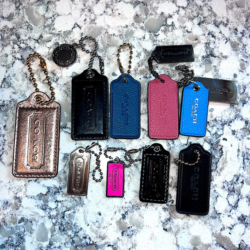 Coach hang tags/ bag charms multi color lot. Various sizes.